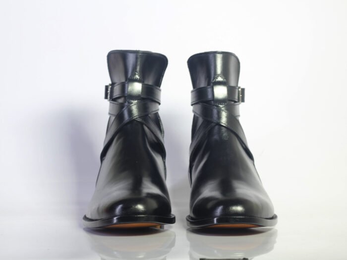 stylish black leather boots featuring decorative buckles on the side