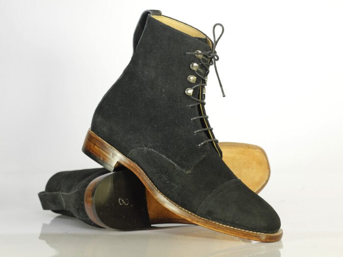 "Black Suede Ankle Boots: Handcrafted Men's Designer Footwear Elevate your style with these luxurious, handmade boots featuring: - Black suede leather - Classic cap toe design - Lace-up closure - Expertly handcrafted for exceptional quality