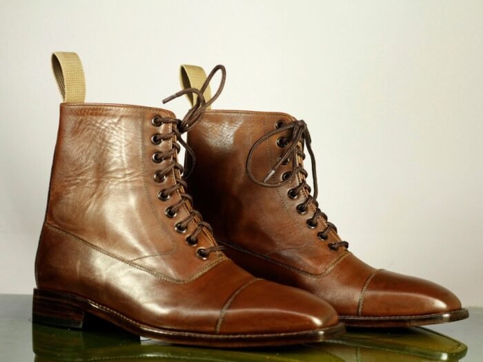 - Rich brown leather - Classic cap toe design - Lace-up closure for secure fit - Handcrafted for exceptional quality