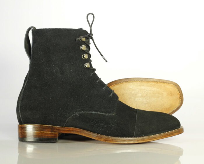 "Black Suede Ankle Boots: Handcrafted Men's Designer Footwear Elevate your style with these luxurious, handmade boots featuring: - Black suede leather - Classic cap toe design - Lace-up closure - Expertly handcrafted for exceptional quality